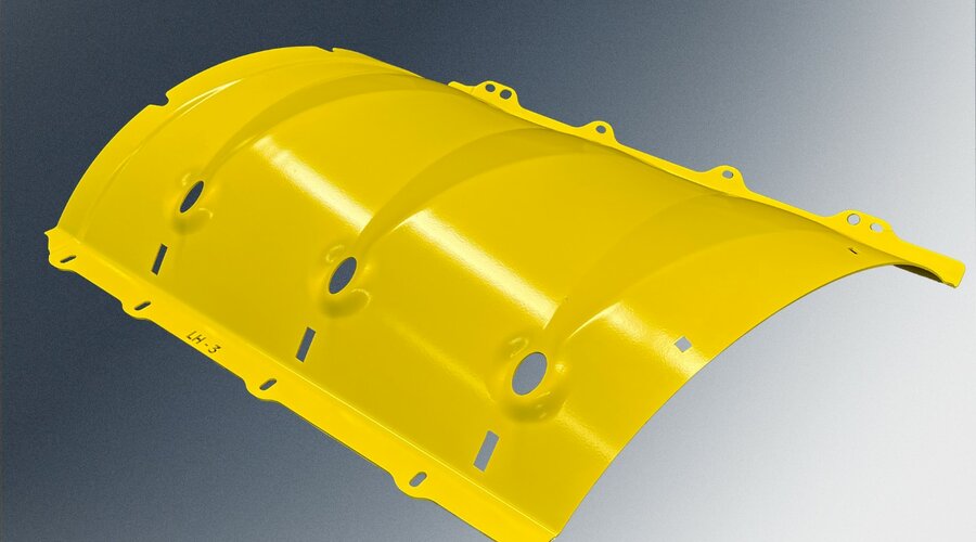 A yellow-painted drum for agricultural machinery with a robust construction and precise manufacturing, designed for high load capacity and longevity.